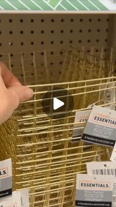 a person is pointing to the label on a basket