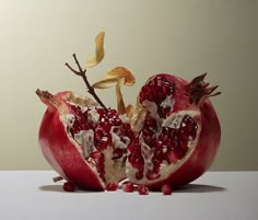 the pomegranate is cut in half and ready to be eaten