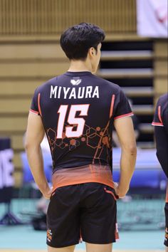 a man standing on top of a basketball court wearing a jersey that says miyaura