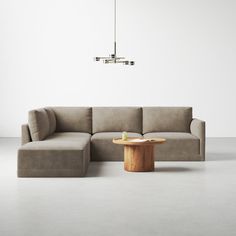 a couch and table in an empty room