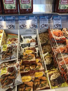 many different types of food on display in a store