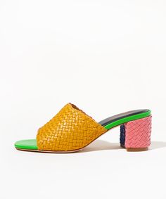 Who is she? If you loved Lenu, you probably like color. And if you like color, you'll definitely love Katie Kortman, which is exactly why we asked her to be our second-ever CS Color Muse™ and color everyone's favorite multicolor shoe. She's still hand-woven in India using soft multi-toned Nappa leather from her upper to her 2.5" heel, and she's still equal parts statement shoe and jeans-and-tee slide, but this time, she's in every color Katie could possibly imagine. Click here to get to know the Multicolor Medium Width Heels For Spring, Spring Multicolor Medium Width Heels, Designer Heels With Woven Sole For Spring, Multicolor Leather Sole Sandals For Spring, Multicolor Sandals With Leather Sole For Spring, Multicolor Leather Heels For Spring, Casual Multicolor Heels With Stacked Heel, Multicolor Leather Heels With Contrasting Heel Counter, Bold Multicolor Sandals For Spring