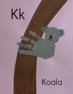 a handprint koala is on the side of a tree