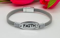 This beautiful inspirational FAITH bracelet is made with a grey leather strap and magnetic closure.  Faith metal bar is 1" All items ship in a gift box. Thank you for visiting Chosen By His Grace ❤️ If you have any questions feel free to message me! I will respond to you right away. Follow on Instagram @chosen.by.his.grace for the latest items and some daily inspiration! Sign up for EXCLUSIVE discounts https://chosenbyhisgrace.com ⭐ WEBSITE - https://chosenbyhisgrace.com ⭐ FACEBOOK - https://www By His Grace, Faith Bracelet, Arm Jewelry, Leather Bangle, Gemstone Bangle, Christian Jewelry, Cross Bracelet, Women's Jewelry And Accessories, Metal Bar