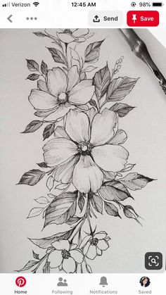 a pencil drawing of flowers on a sheet of paper with an instagramr nearby