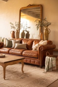 a living room filled with furniture and a large mirror