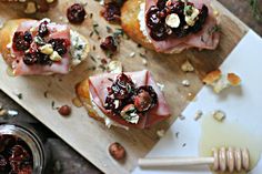 small appetizers with cranberry sauce and nuts on a cutting board