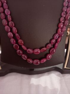 AAA 478 Carat Fine Quality Natural Ruby Smooth Plain 20 Inch Necklace Adjustable code Stone :Natural Ruby Shape :- fancy oval Necklace - 20 inch 2 line string Size :- 5x7mm to 10x12mm Weight :- 478 carat Polish :- Handmade Purity :- 100% Natural Gemstone color - red makes a great gift for your loved ones. It is known as the 'love stone' as the message it emits is the strong vibration of unconditional love, joy, warmth and healing. As quartz crystals are profound amplifiers of energy, it may help 20 Inch Necklace, Carnelian Bracelet, Oval Necklace, Ruby Beads, Multi Sapphire, White Tassel, Oval Beads, Ruby Necklace, 108 Bead