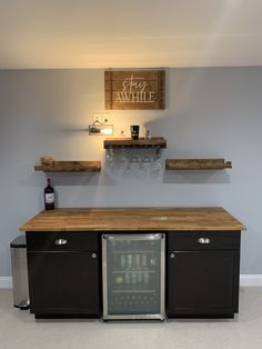 a small refrigerator and some shelves in a room