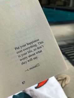 someone holding up a piece of paper that says, put your happiness over everything this is your life so worry about what they will say