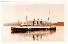 an old photo of a large boat in the water