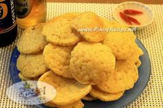 a plate full of cookies next to a bottle of beer