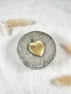 Antique Heart Locket  15ct Gold Tested  Circa 1920's  Gorgeous sized, heart shaped antique locket.  Beautiful, yellow gold matt finish, with engraved initials on the reverse. The insides are intact & in very good condition. Would make a lovely gift!  Measures approx height 32.5mm & width 27.6mm  Weight 8.6g  *chain sold separately  Can be resized using our resizing service, please contact us for more information. All of our items are either Antique, Vintage or Preloved. They are in used conditio Antique Gold Jewelry With Heart Charm For Anniversary, Gold Heart Locket Necklace With Heart Charm, Antique Gold Heart Charm Jewelry For Anniversary, Hallmarked Heart Locket Necklace For Wedding, Antique Gold Wedding Jewelry With Heart Charm, Classic Gold Locket Necklace With Heart Charm, Antique Gold Jewelry With Heart Charm For Wedding, Antique Gold Jewelry With Heart Charm, Heirloom Yellow Gold Locket Necklace With Heart Charm