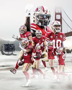 a group of football players standing next to each other in front of the golden gate bridge