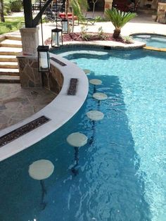 an empty swimming pool with steps leading up to it