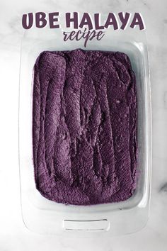 a purple cake in a plastic container with the words ube halaya recipe written on it