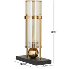 a brass and glass lamp on a black stand with measurements for the base, which is inches tall