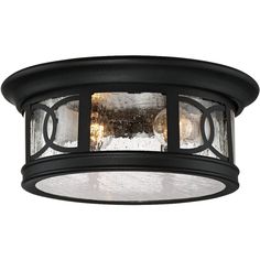 an outdoor light fixture with frosted glass on the front and side panels in black