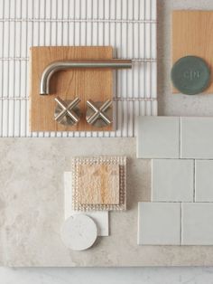 an overhead view of tile and accessories on a counter top, including a soap dispenser