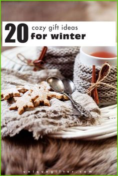 a white plate topped with cookies on top of a fur covered tablecloth next to a cup of tea