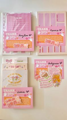 four pink and white cards with words on them