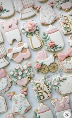 baby shower cookies are arranged on a table