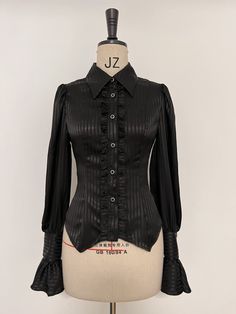 Add a touch of elegance to your Lolita wardrobe with this Black Ouji Long Sleeves Shirt. Featuring a charming jabot bowtie and intricate lace-up detailing at the back, this shirt is the perfect combination of classic and contemporary style. Whether you're attending a tea party or a casual outing, this shirt is sure to make a statement.   	 		 			Size 			S 			M 			L 			XL 			2XL 		 		 			Bust 			86 			90 			94 			98 			102 		 		 			Waist 			68 			72 			76 			80 			84 		 		 			Shoulders 			34 			35 			36 			37 			38 		 		 			Full Length 			62 			63 			64 			65 			66 		 		 			Sleeve Length 			69 			70 			71 			72 			73 		 		 			Cuff 			21 			22 			23 			24 			25 Black Long Sleeve Shirt Outfit, Long Sleeve Shirt Outfits, Ouji Fashion, Vintage Attire, Kei Fashion, Lolita Outfits, Alt Outfits, Fashion Design Clothes, Cosplay Outfits