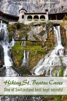 a waterfall in front of a stone building