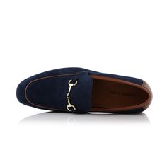 Step into timeless elegance with our suede loafers. Featuring a stylish buckle ornament, these shoes can offer both comfort and charm for any occasion. Brand: Ferro Aldo Apron toe loafer with buckle along the top Easy slip-on access Memory foam insoles for added comfort Upper: Synthetic Suede Lining: Microfiber Elegant Suede Monk Strap Slip-on Shoes, Office Slip-on Loafers With Tang Buckle, Suede Slip-on Loafers With Buckle Closure, Suede Buckle Closure Slip-on Loafers, Elegant Slip-on Loafers With Buckle Closure, Elegant Slip-on Loafers With Metal Pin Buckle, Elegant Flat Loafers With Buckle Closure, Formal Flat Loafers With Buckle Closure, Suede Loafers