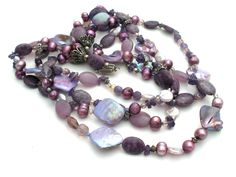 Vintage Statement Jewelry - This is a substantial four strand bead necklace with shell, pearl, agate, amethyst, crystal, charoite beads and sterling silver spacers, bead caps and clasp. It is 20" long, approximately 1.75" wide, weighs 175 grams and hallmarked TS-151 Mexico 925. Elegant Purple Agate Beaded Necklaces, Elegant Purple Agate Beaded Necklace, Purple Multi-strand Gemstone Beads Jewelry, Purple Amethyst Gemstone Beads Pearl Necklace, Purple Amethyst Pearl Necklace With Gemstone Beads, Purple Agate Gemstone Beaded Necklace, Purple Jewelry With Polished Oval Beads, Elegant Multi-strand Purple Beaded Necklaces, Elegant Purple Multi-strand Beaded Necklaces