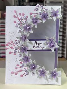 a handmade birthday card with purple flowers