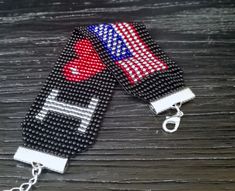 In this listing I present to your Fourth of July stars and stripes seed bead crochet hippie flag bracelet. It can be good idea for Memorial Day gift jewelry. The length of this wide adjustable American flag bracelet is from 6.89 to 8.46 inches, the width is 1.26 inches. It is made of Czech beads of black color and shining red, blue and silver. It looks very impressive and shines brightly in the sun. I decided to make a small line of jewelry on the theme of the American flag. In my store you can also find other jewelry with the flag of America, such as bracelets, earrings and necklaces. Also I can make such a bracelet with your name, congratulations, date of birth, with the name of your favorite basketball or other sports team. The bracelet can be of different lengths, widths and any colors Adjustable Friendship Bracelets For 4th Of July, Patriotic Beaded Bracelets For Independence Day, Handmade Patriotic Beaded Bracelets For 4th Of July, Adjustable Patriotic Friendship Bracelets For 4th Of July, Patriotic Adjustable Friendship Bracelets, Patriotic Multicolor Friendship Bracelets, Adjustable Patriotic Friendship Bracelets, Handmade Multicolor Bracelets For 4th Of July, Handmade Multicolor Beaded Bracelets For 4th Of July