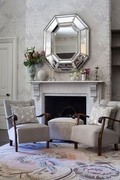 a living room filled with furniture and a fire place in front of a wall mounted mirror