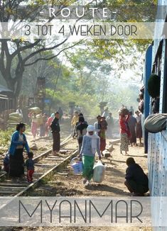 many people are walking on the railroad tracks