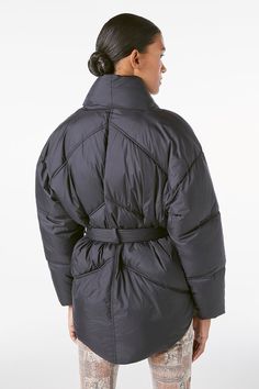 This modern puffer vest is made from 100% recycled nylon with recycled fill, combining fashion, function, and eco-friendly design. The oversize silhouette and feminine belt put a fashion-forward spin on the supremely cozy layer, making it a real hero piece in your winter wardrobe. 100% Recycled Nylon Dry Clean Only 26" Long From Shoulder Shrunken Sweater, Tie Up Shirt, Winter Puffer Jackets, Winter Comfort, Denim Clothing, Country Women, Vancouver British Columbia, Quilted Puffer Jacket, Puffer Jacket Women