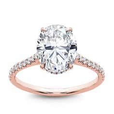 a rose gold engagement ring with an oval cut diamond