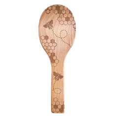 a wooden spoon with bees and honeycombs engraved on the side, isolated against a white background