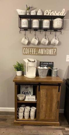 a coffee bar with cups and mugs hanging on the wall