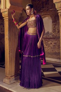 Bangani cutwork cape with resham, metal coin embroidered border. Paired with floral embroidered blouse and pleated skirt. - Aza Fashions Cape Skirt, Punit Balana, Blouse Satin, Embroidered Cape, Embroidered Border, Purple Skirt, Satin Blouses, Skirt And Blouse, Silk Embroidery