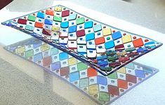 a multicolored glass plate sitting on top of a counter