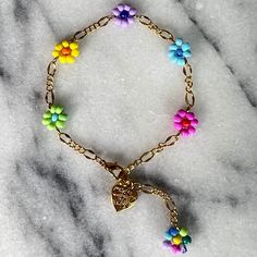 Summer collection 2023 - Myltu color flower bracelet with gold detailing. Bracelets are made to order. Please let me know you wrist size. Handmade Gold Bracelets For Spring, Gold Flower-shaped Bracelet With Flower Decoration, Handmade Colorful Flower Shaped Bracelets, Handmade Colorful Flower Bracelets, Trendy Colorful Flower Jewelry, Colorful Flower Bracelets For Gifts, Colorful Flower-shaped Bracelets For Gifts, Colorful Flower Bracelets As Gift, Handmade Gold Flower Charm Bracelet