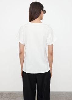 ###main_image:tops Monogram Embroidery, Pleated Trousers, Relaxed Jeans, S Signature, Organic Cotton Fabric, Fitted Silhouette, Tailored Trousers, Soft Light, White Undershirt