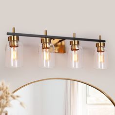 A new stylish modern look to update and enliven your home decoration. This 4-light brass gold bathroom vanity light will be a highlight in any house style. The great combination of shiny brass gold and vintage black adds a feeling of modern industrial and classic aesthetic while the bell-shaped clear glass shades help to provide bright lighting for your bathroom or powder room. Working with a dimmer switch and dimmable bulbs (both sold separately), the black indoor wall sconce can be installed f Gold Bathroom Vanity Light, Gold Bathroom Vanity, Modern Bathroom Vanity Lighting, Black And Gold Bathroom, Brass Vanity Light, Black Vanity Light, Black Bath, Contemporary Vanity, Vanity Light Fixtures