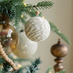 christmas ornaments hanging from the branches of a tree