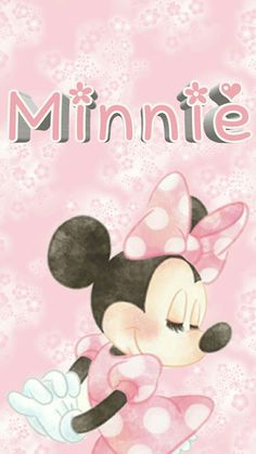 a minnie mouse with pink and white polka dots on it's face, standing in front of a pink background