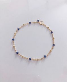 * DETAILS* - AAA+ Burma Blue Sapphire Faceted Beads 2mm - 14k Gold Filled Chain - 14k Gold Filled Spring Ring Clasp ✨ All components are 14k Gold Filled. 👉🏻 How to measure 1. Use a string to mark the spot you would like your bracelet. (⭐️remember to add some space for a loose fit) 2. Lay the string flat and measure the string's length with a ruler to get your final length. 👉🏻 You may also like the matching necklace. Please check here. https://www.etsy.com/JinnysJewelryBySeJin/listing/8715687 Wear Perfume, Special Birthday Gifts, Gold Bond, Birthstone Bracelets, September Birthstone, Dainty Bracelets, Birthday Gifts For Women, Polish Jewelry, Matching Necklaces