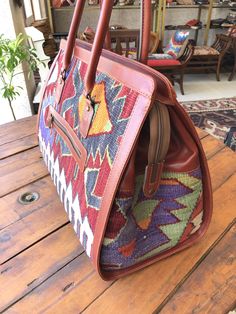 Thank you for visiting our shop!! These bags are 3 size (SML). This is Large size. You can use in your holiday!! We select beautiful old kilim from all over the Anatolian area and middle east area. and We do special wash for Kilim rug first, after that cut the kilim to remake unique kilim bags at our atelier one by one. All products have been produced in a smoke-free environment. Vintage kilim with colored with natural dyes Size : 56cm x 40cm x 27cm Material : wool / leather After received payme Traditional Rectangular Duffle Bag For Travel, Large Travel Bags With Detachable Handle, Bohemian Rectangular Bag With Luggage Sleeve, Bohemian Rectangular Duffle Bag With Leather Handles, Traditional Tote Travel Bag With Leather Handles, Bohemian Rectangular Weekender Bag With Luggage Sleeve, Traditional Travel Tote Bag With Leather Handles, Bohemian Weekender Bag For Weekend Trips, Traditional Travel Satchel With Leather Handles