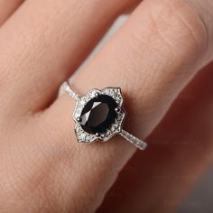 ◆ The ring is handcrafted from sterling silver and decorated with a dazzling 6*8mm black spinel. It is suitable for engagement/party/daily occasion. ◆ Production Description: Main stone Type: black spinel Main Stone Shape: Oval cut Main Stone Size: 6*8mm(1.45ct) Side stone: CZ Metal: 925 Sterling silver - Other options available in the drop down menu ◆ Customization: √Add Engraving √Other Metal Type Available √Other Gemstones & Shapes Available √Personalization Requests Available ◆ Packaging Fine Jewelry Sapphire Ring With Black Spinel For Anniversary, Fine Jewelry Black Spinel Sapphire Ring For Anniversary, Black Spinel Sapphire Ring For Anniversary, Black Sapphire Fine Jewelry, Black Sapphire Fine Jewelry Ring, Elegant Black Spinel Rings For Gift, Elegant Black Sapphire Ring, Elegant Black Flower Ring, Elegant Black Spinel Sapphire Promise Ring