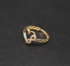 Product Description: Experience the eternal beauty of love with our 14K Real Solid Yellow Gold Infinity Heart Ring - a symbol of infinite affection and genuine elegance. Key Features: Material: Crafted from genuine 14K Yellow Gold, this ring is properly stamped for authenticity. Finish: Polished to perfection, the radiant glow adds a touch of sophistication to your style. Band Thickness: A minimalist 2 mm band provides a perfect balance of subtlety and style. Infinity Symbol Size: 9.5 mm in length and 4 mm in width, representing everlasting love and boundless connection. Heart Size: A captivating heart, measuring 13 mm in length and 12 mm in width, adds a romantic touch. Scale Options: Available in various sizes (6.5US, 7US, 7.5US, 8US, 8.5US) for a personalized fit. Stone: Enhanced with a Gold Infinity Ring, Infinity Heart, Heart Symbol, Infinity Ring, Infinity Symbol, Gold Gemstone Ring, Cubic Zirconia Rings, Gold Accessories, Real Gold