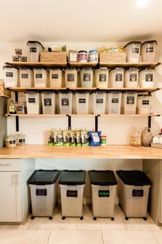 the shelves are filled with containers and bins